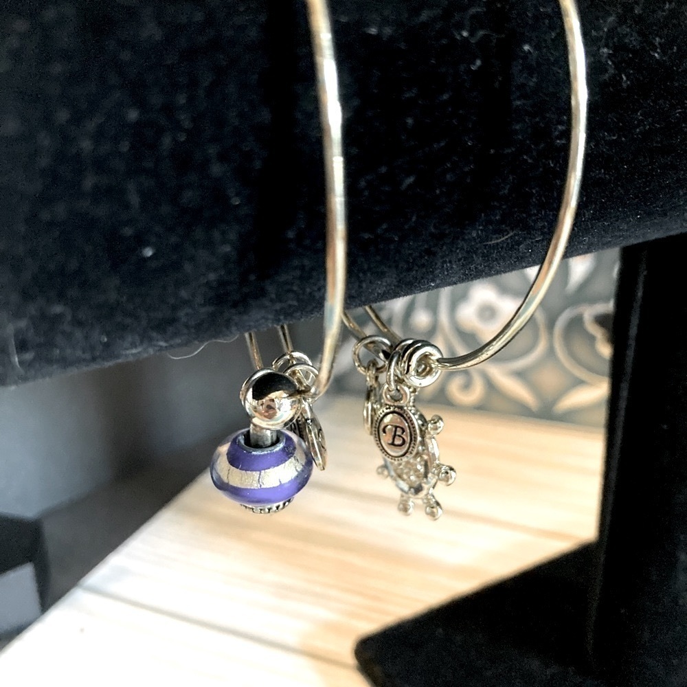Two Brighton Expandable gold tone bracelets.​​